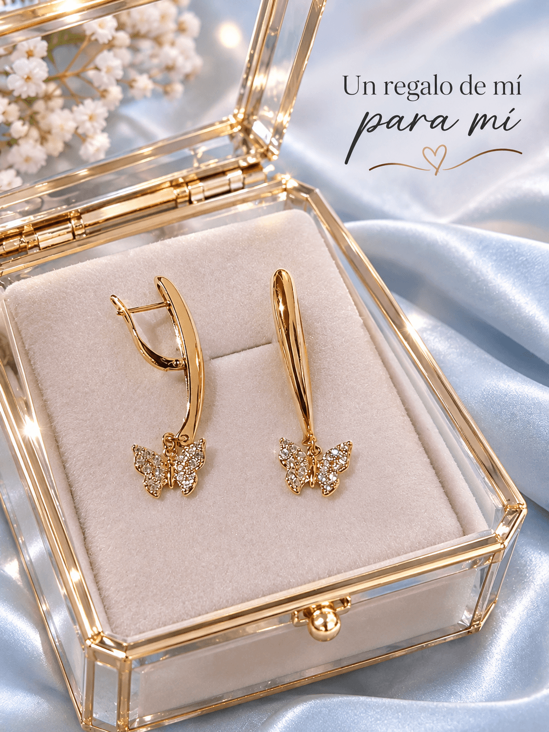 Aretes colgantes dorados con mariposa y cristales